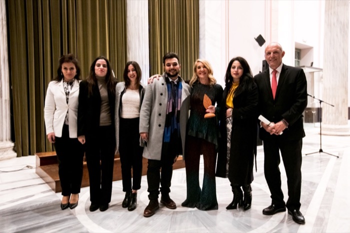 Apollon Papas and his team with an award
